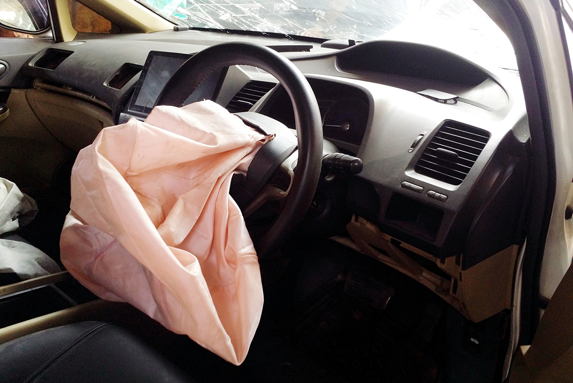 A air bag deflating from a steering wheel.