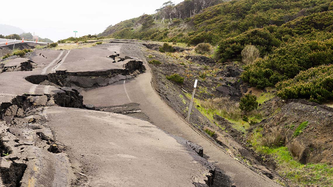 Earthquake damage to the roads with large cracks.
