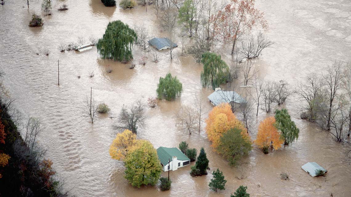 Houses surrounded by flood water.
