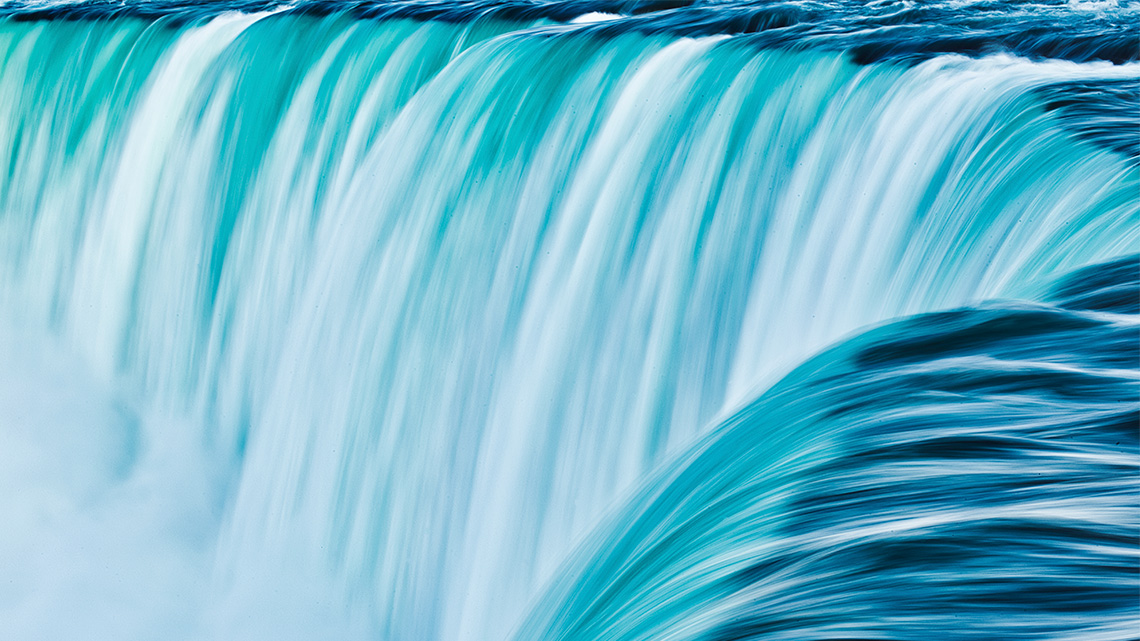A close-up of the water falling over the edge of the Niagara Falls.