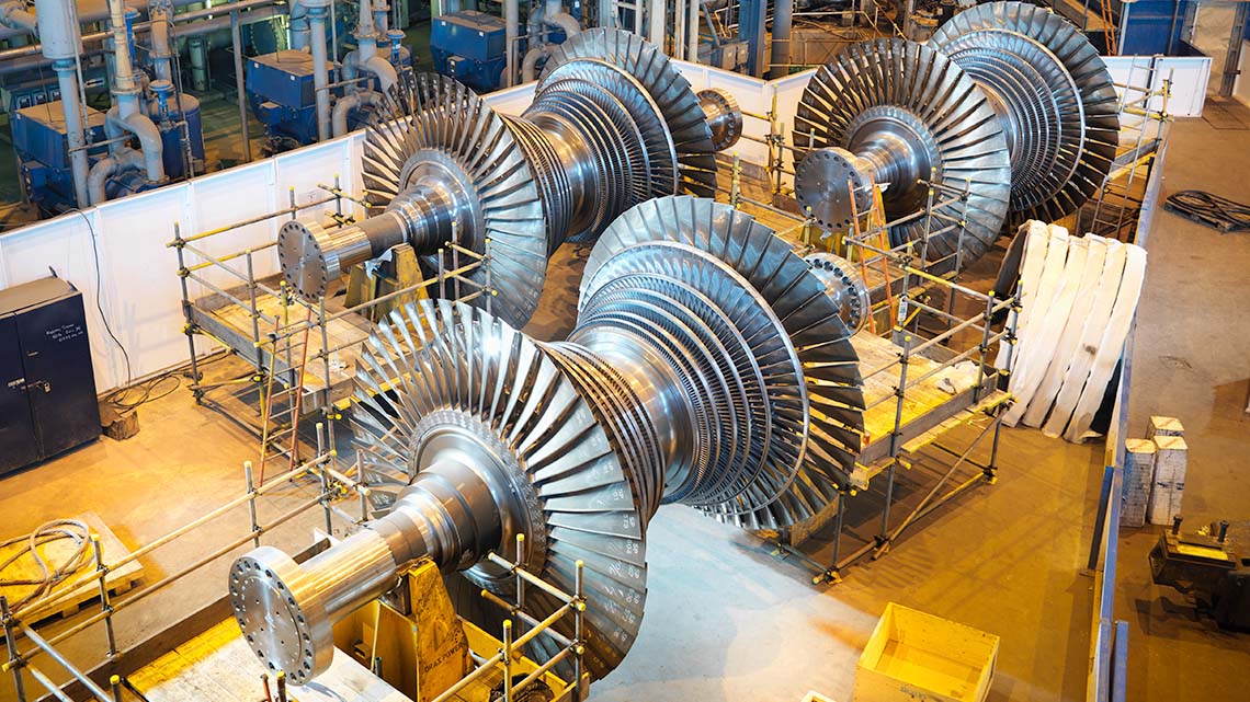 Large turbines in a power station.