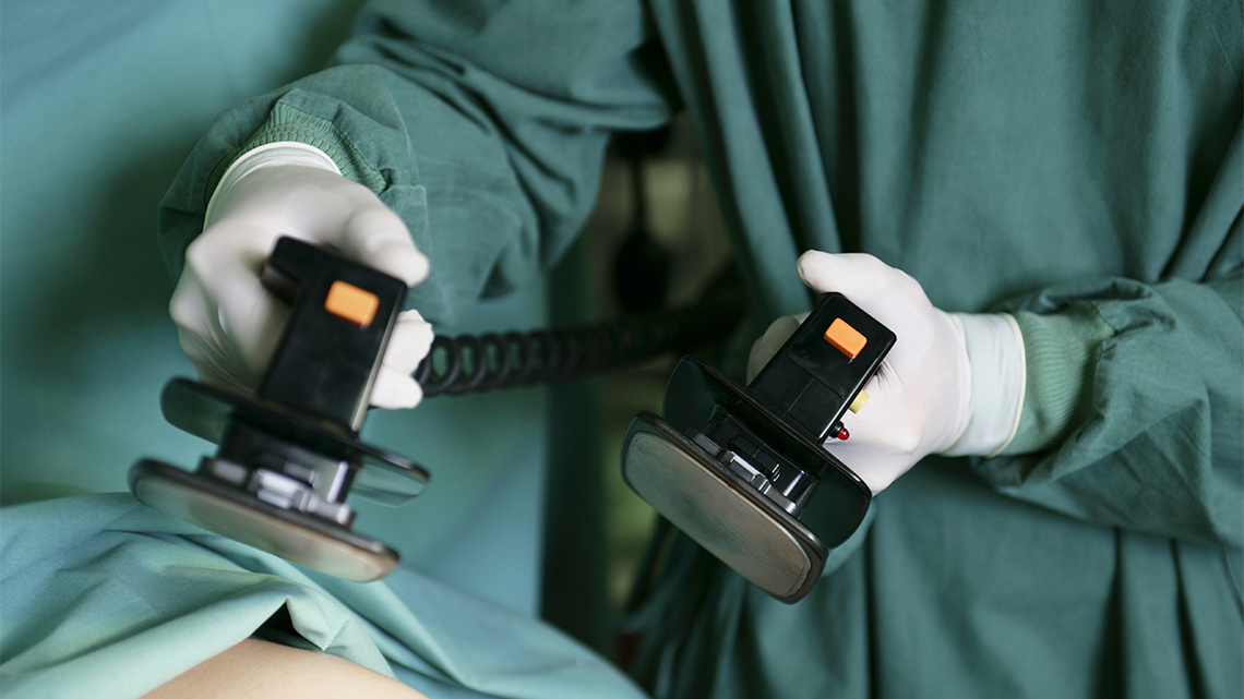 Defibrillator used by a medical professional to revive a patient in the hospital.