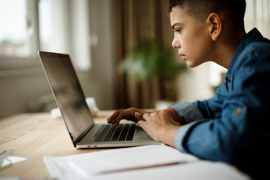 A student working on a computer.