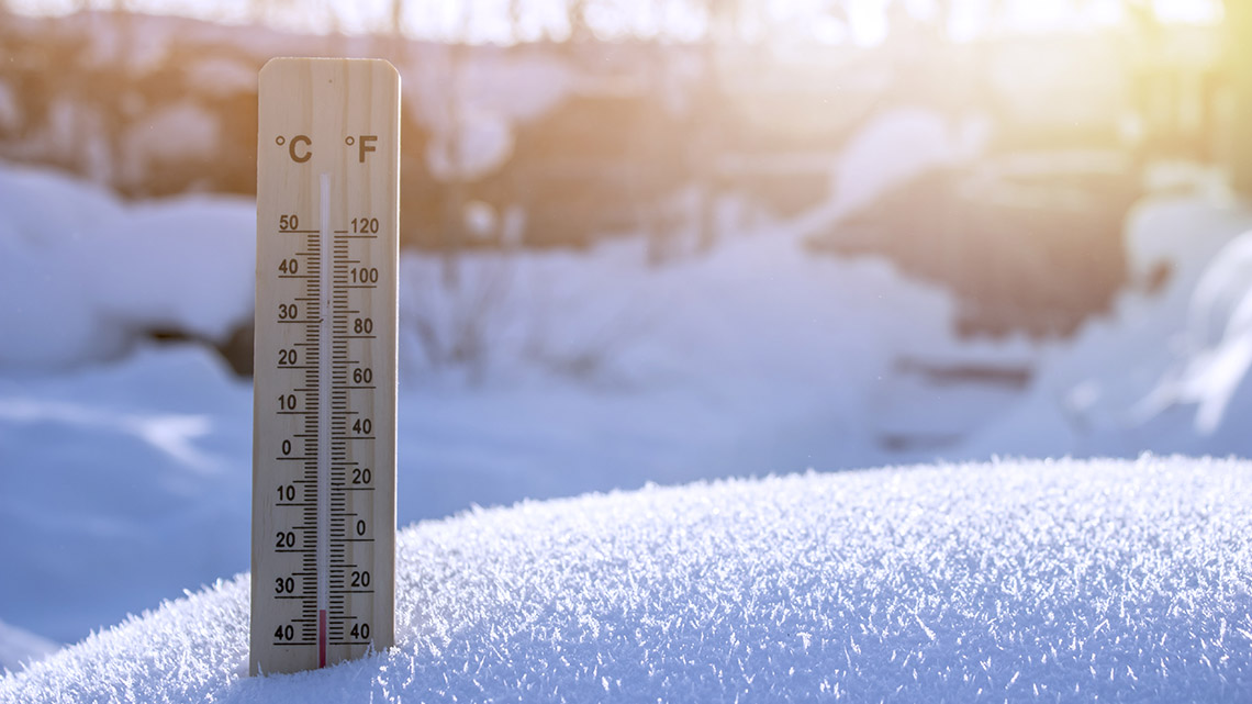 A thermometer in the snow.