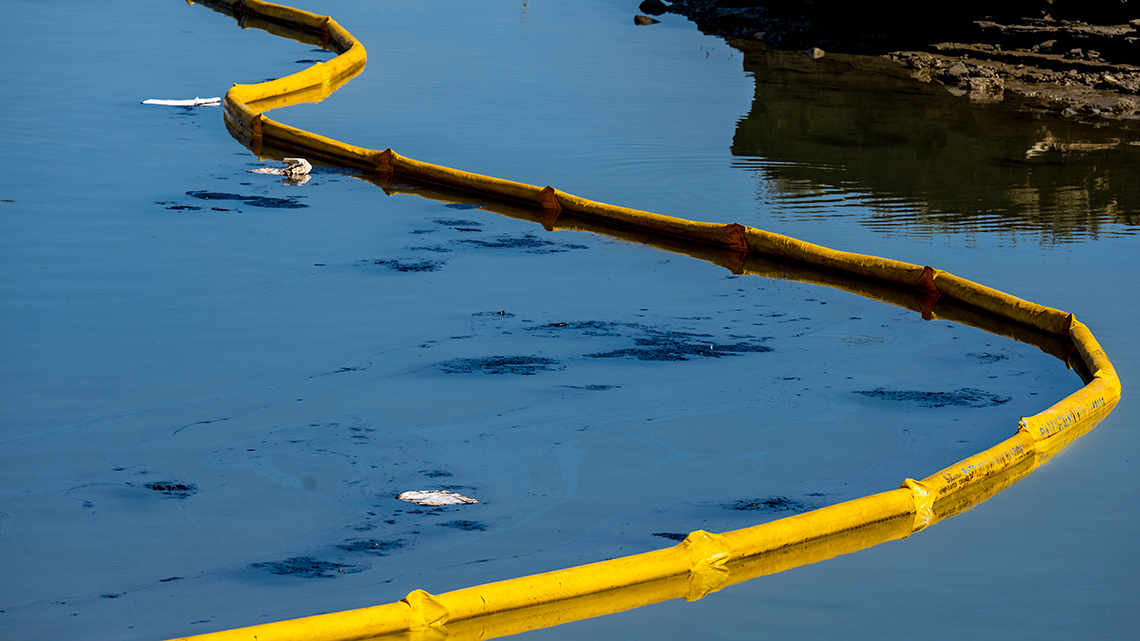 Floating barriers used to contain an oil spill. 
