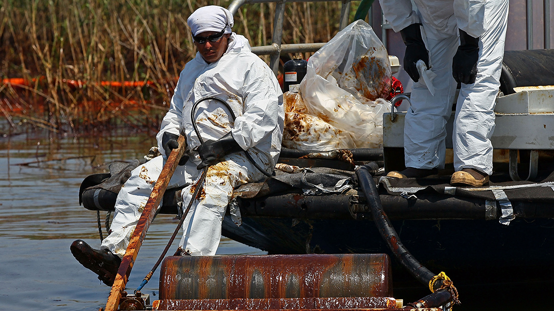 A person sitting on the back of a skimmer. 