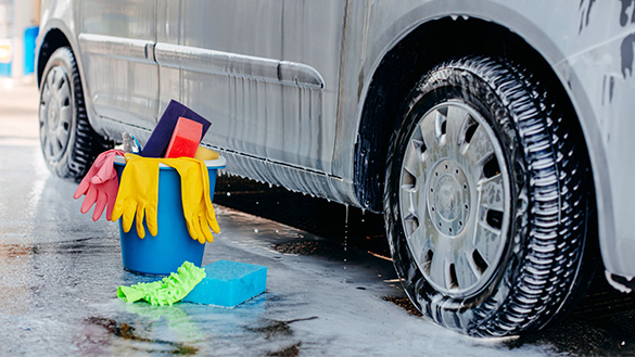 Washed car Detergent drips down a car onto the ground outside.