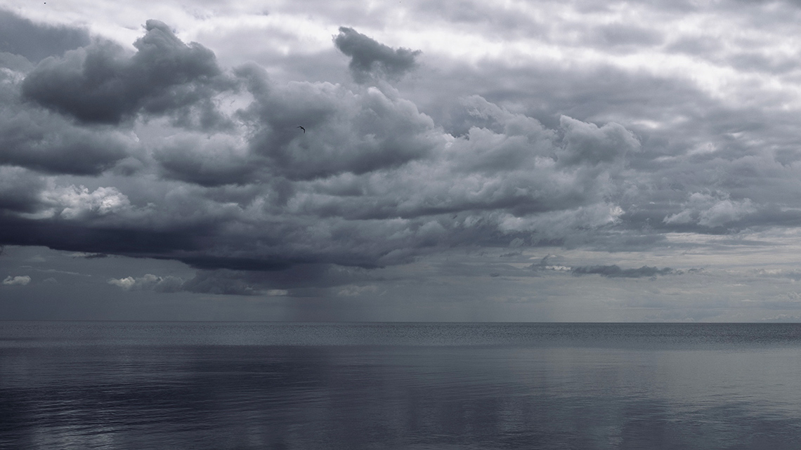Dark storm clouds over the sea.