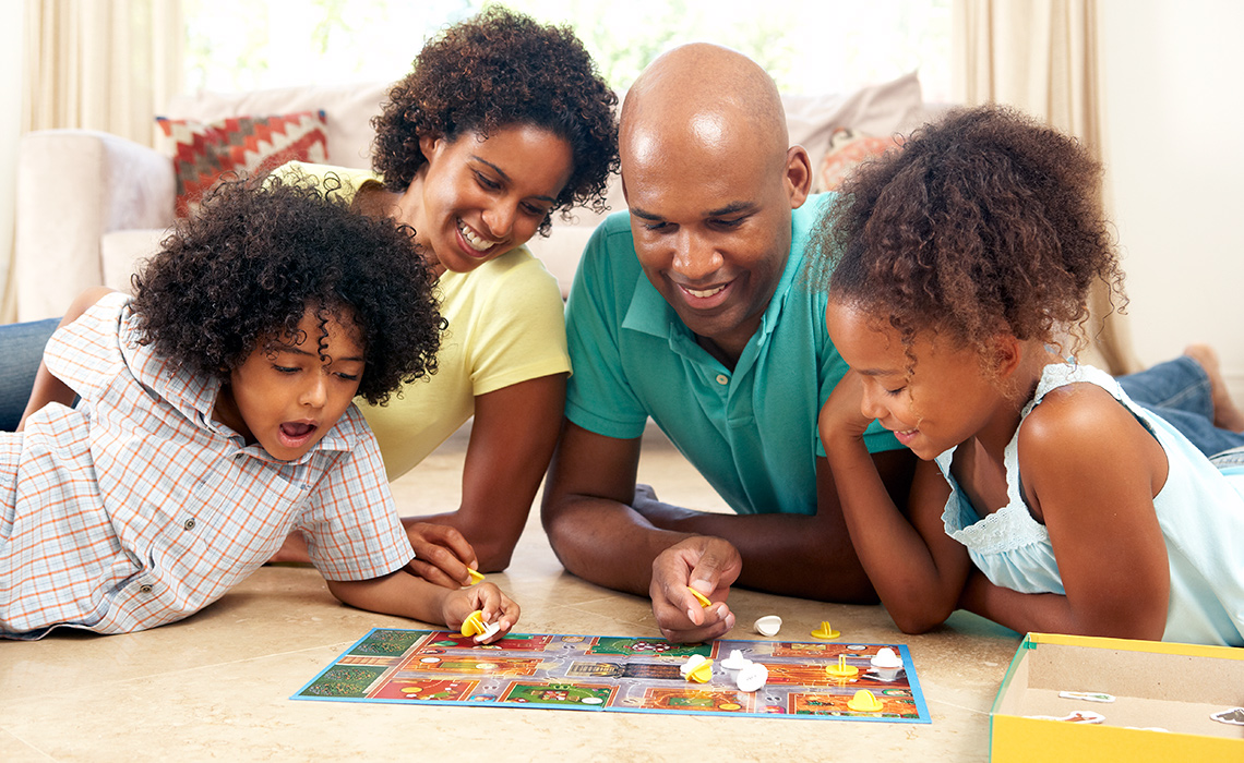 Family playing a board game together