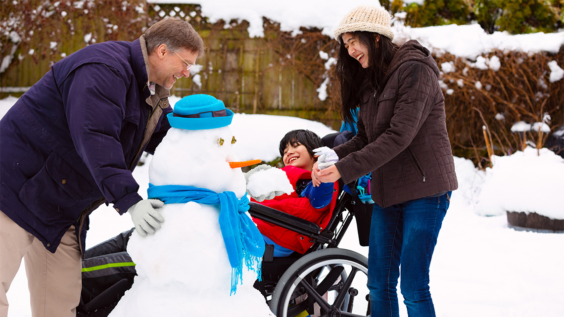 Kids building snowman
