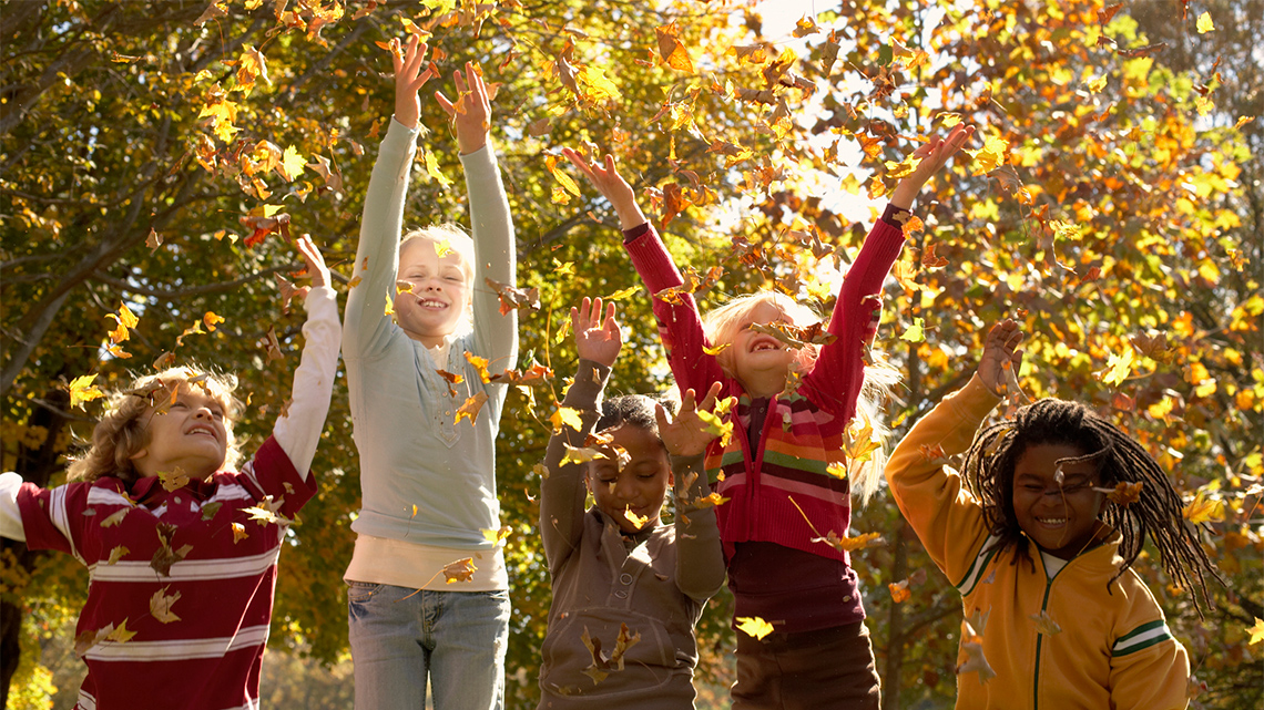 Kids playing in the leaves