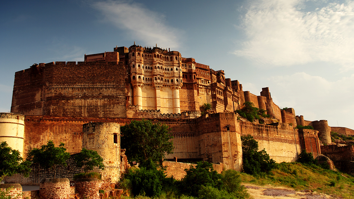 Mehrangarh Fort, India The Mehrangarh Fort on a large hill surrounded by trees.