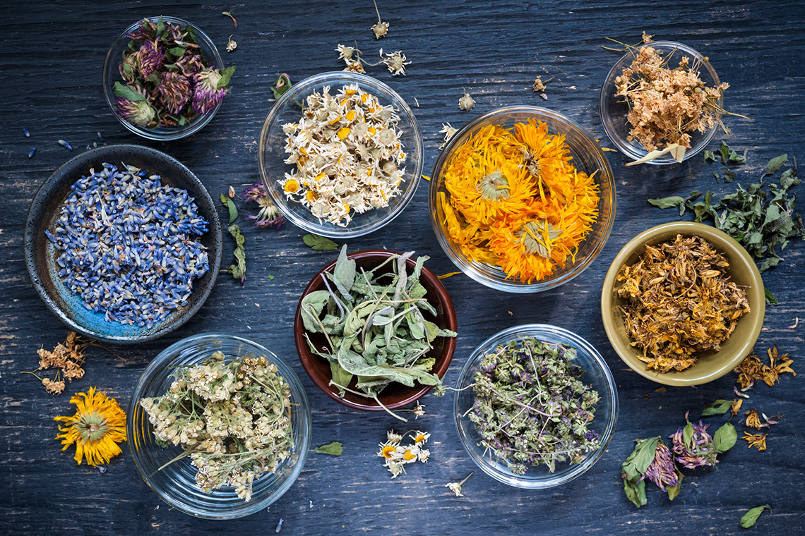Bowls of sage leaves and other medicinal herbs.