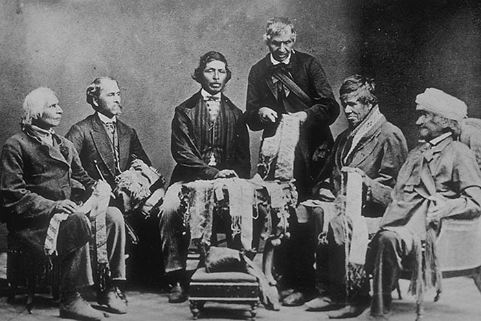 An Ontario First Nations Chief holds a wampum belt.