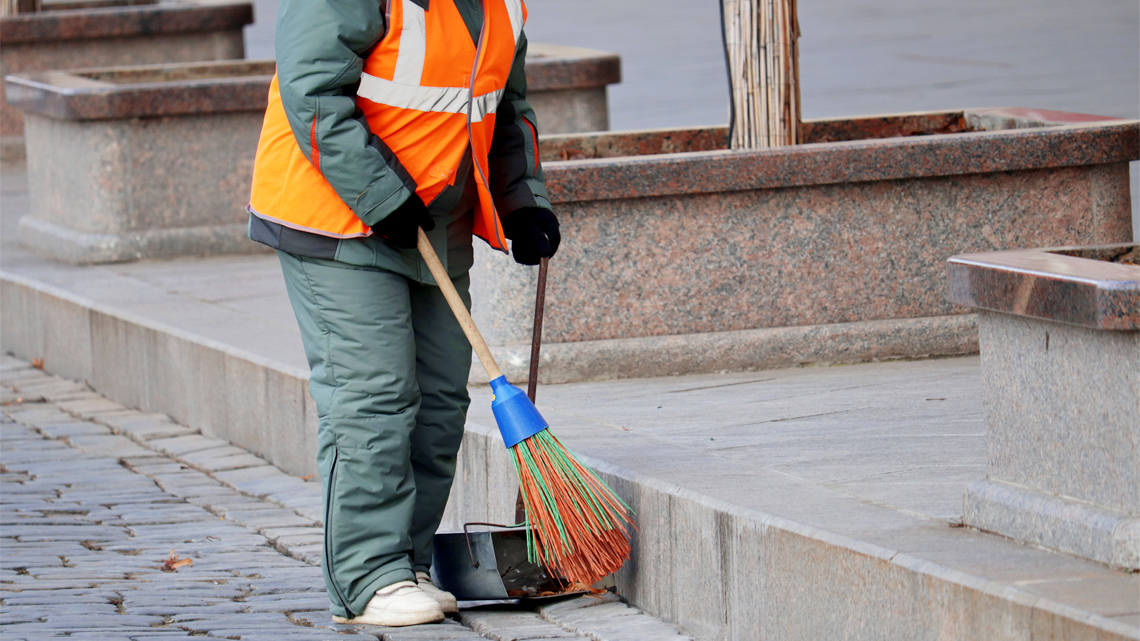 A city worker cleaning the streets.